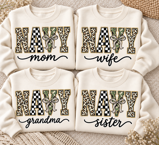 Custom Navy Family apparel shown as four cream sweatshirt flatlays with personalized wording and leopard checkerboard camouflage varsity letters